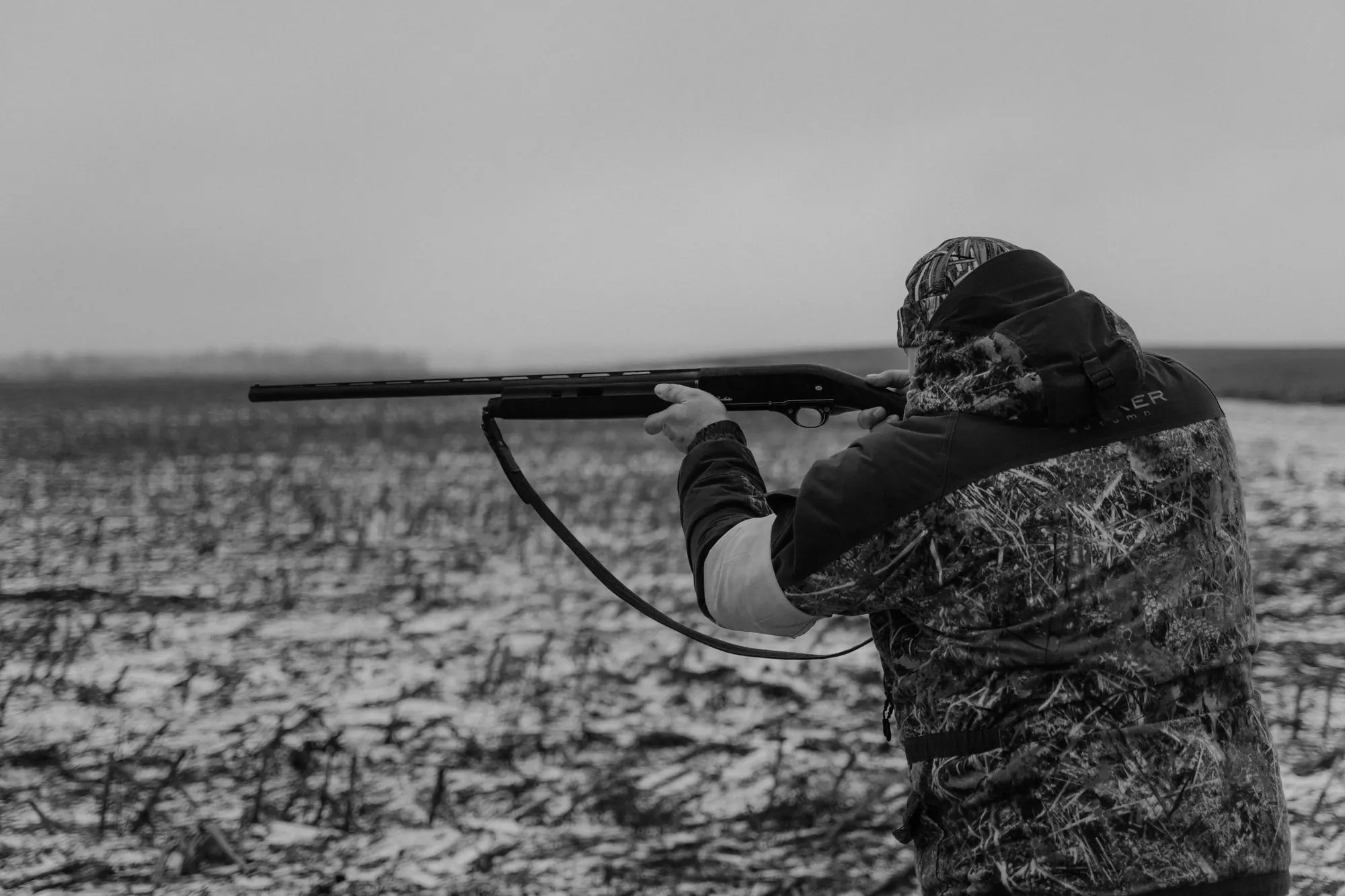 Hunter aiming in a frosty field