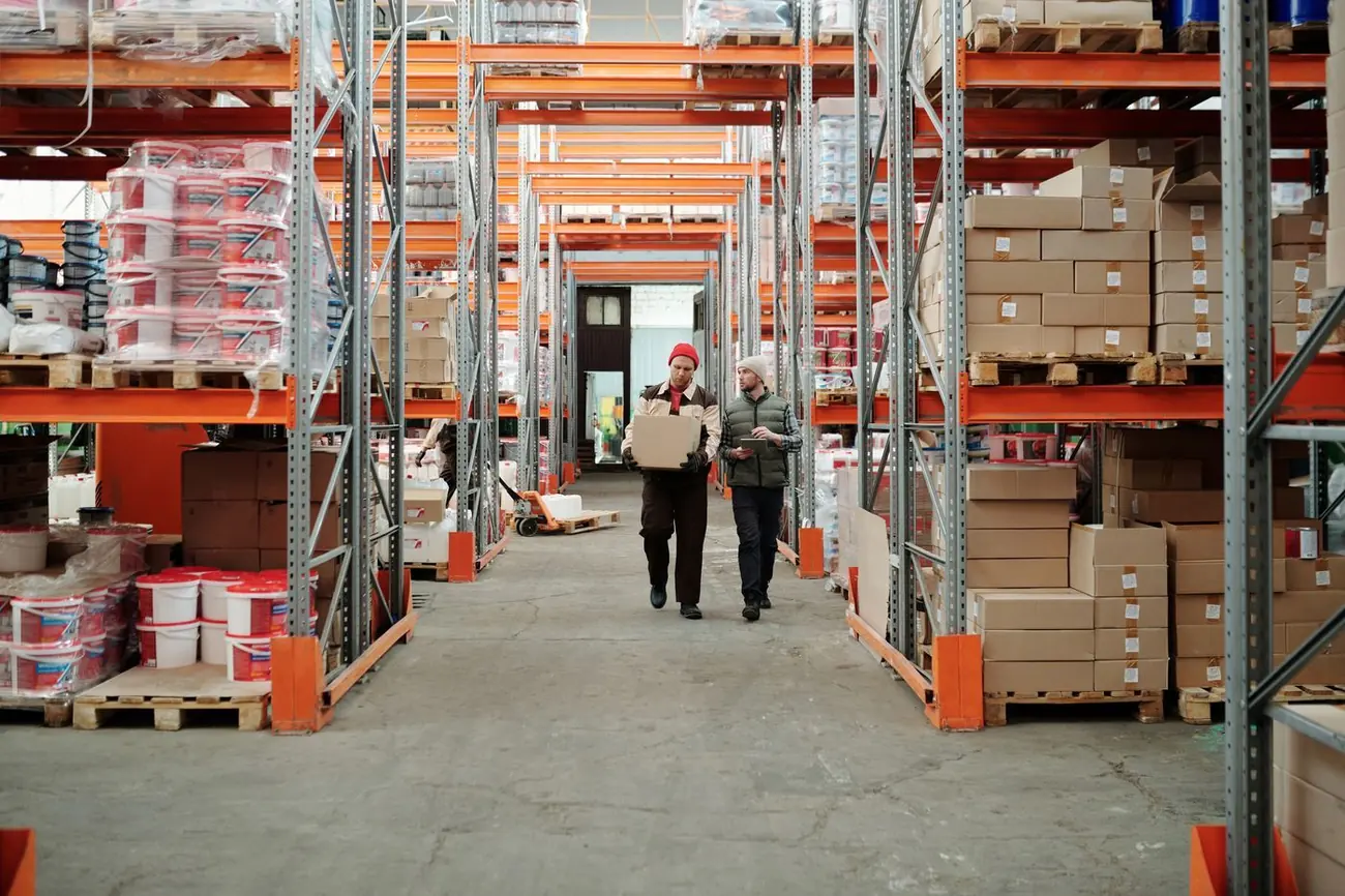 Warehouse aisles stocked with boxed gear